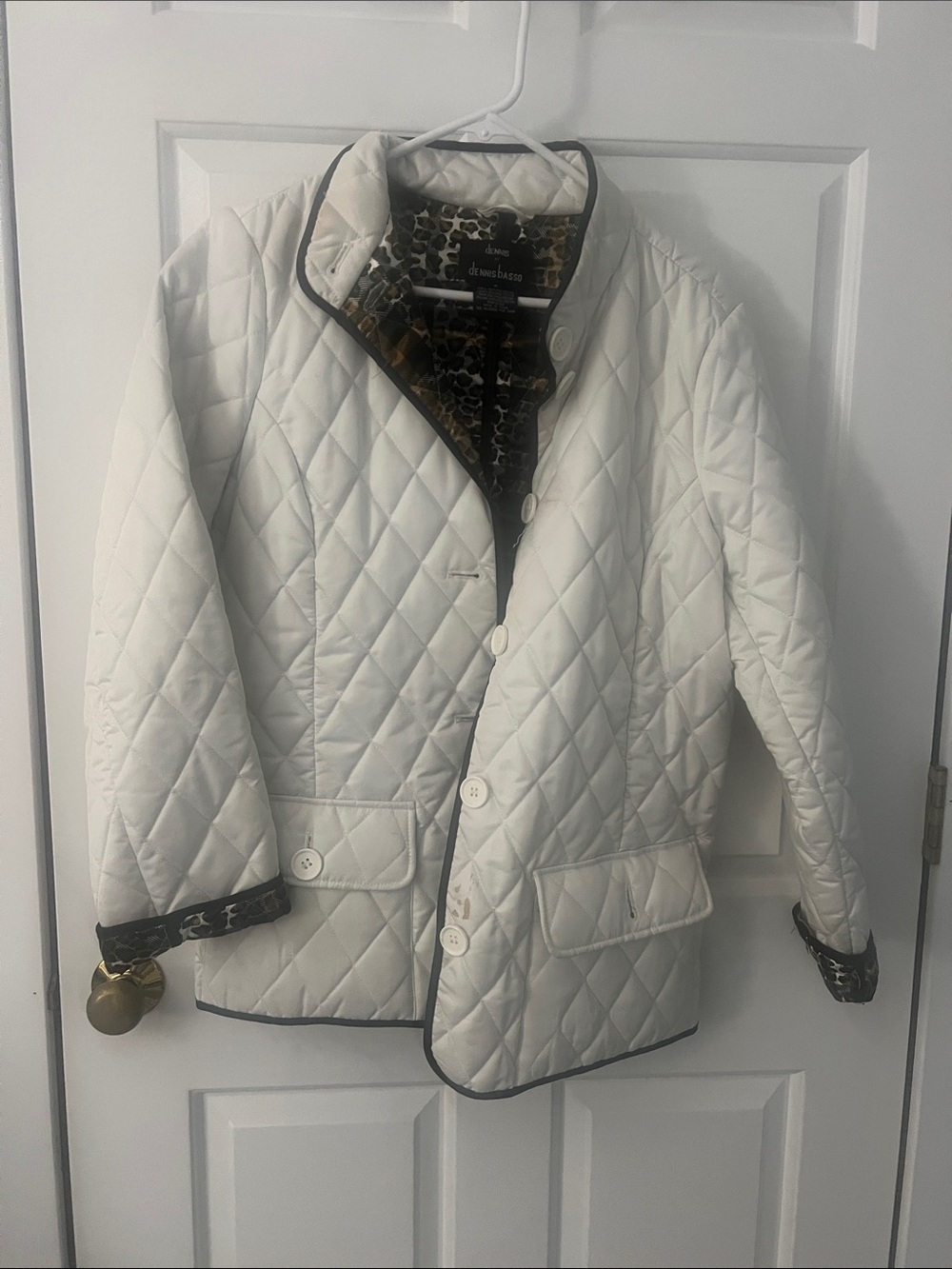 Dennis Basso. 
White Quilted Women's Jacket with animal print trim.